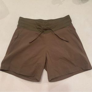 Tuff Athletics. Small brown shorts with pockets and drawstrings.